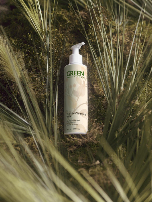 Vegan gentle cleansing milk with organic, cruelty-free ingredients to remove impurities and makeup while soothing and hydrating skin, available at greenmyskin.com.